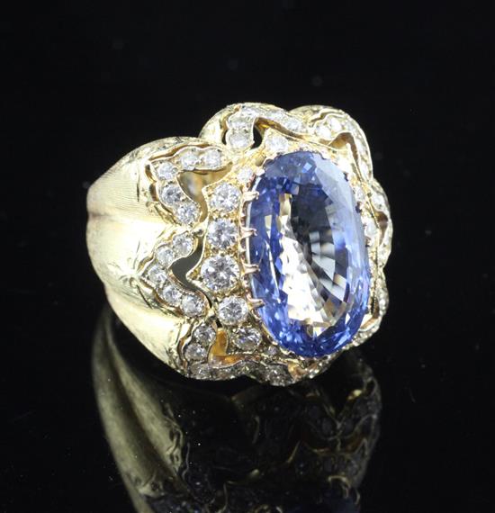A fine textured 18ct gold, Ceylon sapphire and diamond dress ring by Mario Buccellati, Milan, size N.